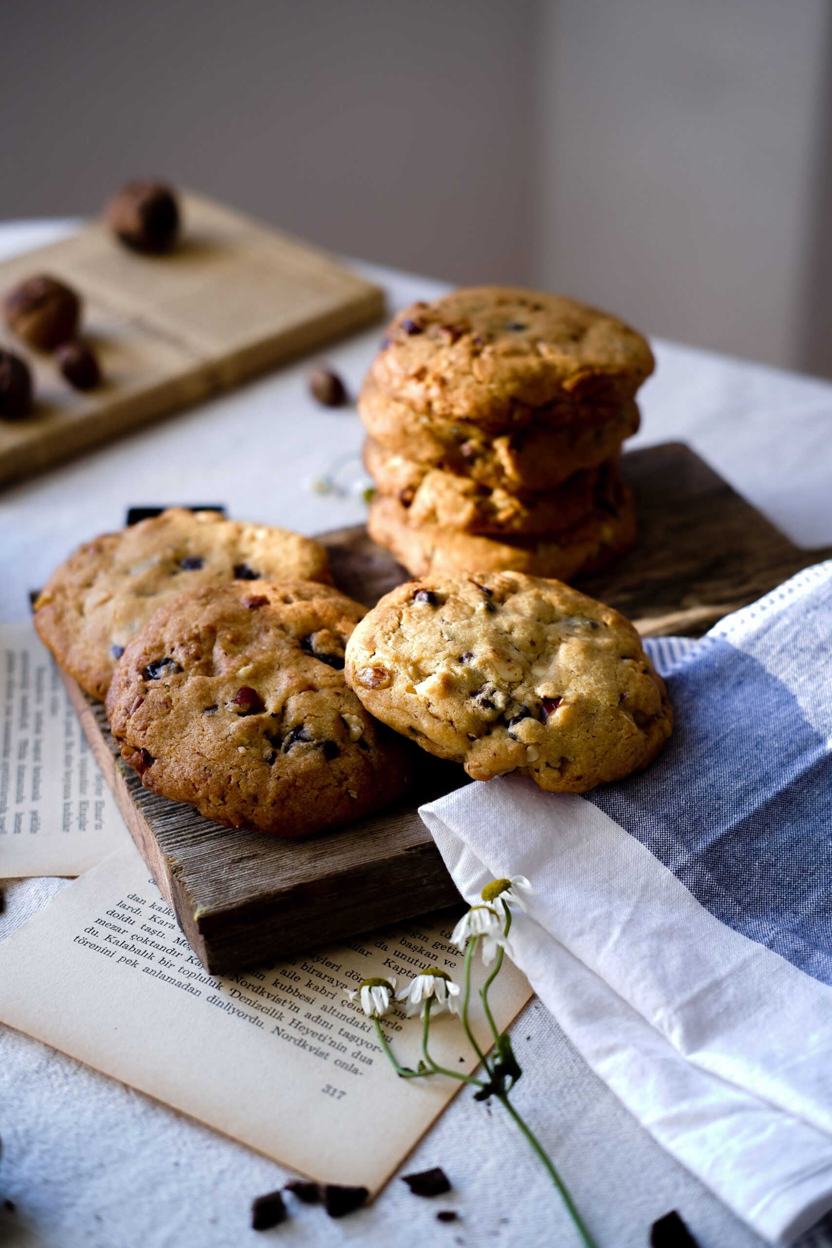 Batch of freshly baked golden brown chocolate chip cookies cooling on a wire rack