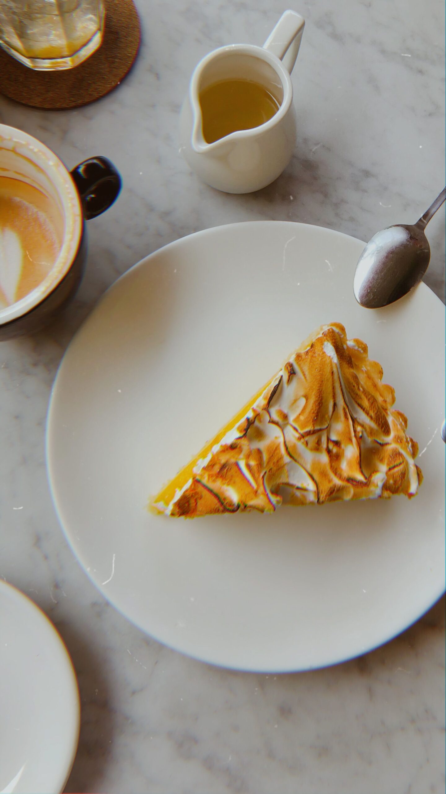 Classic French lemon meringue tart with crisp crust and golden toasted peaks